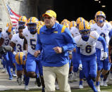 Pittsburgh head coach Pat Narduzzi leads his team onto the field at the start of an NCAA college football game against Virginia Tech, Saturday, Oct. 16, 2021, in Blacksburg, Va. (Matt Gentry/The Roanoke Times via AP)