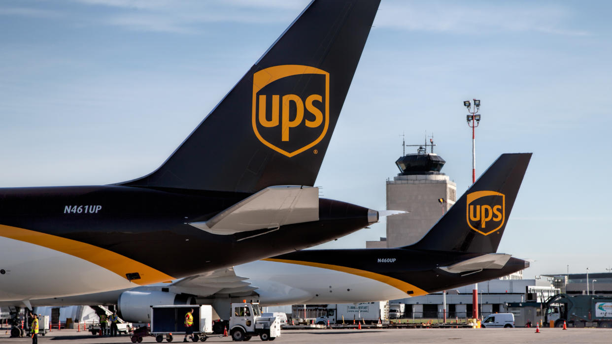 Winnipeg, Canada – July 20, 2016: Two UPS Boeing-757 Cargo Freighters sit on the ramp at Winnipeg James Armstrong Richardson International Airport with the Air Traffic Control Tower in the background.