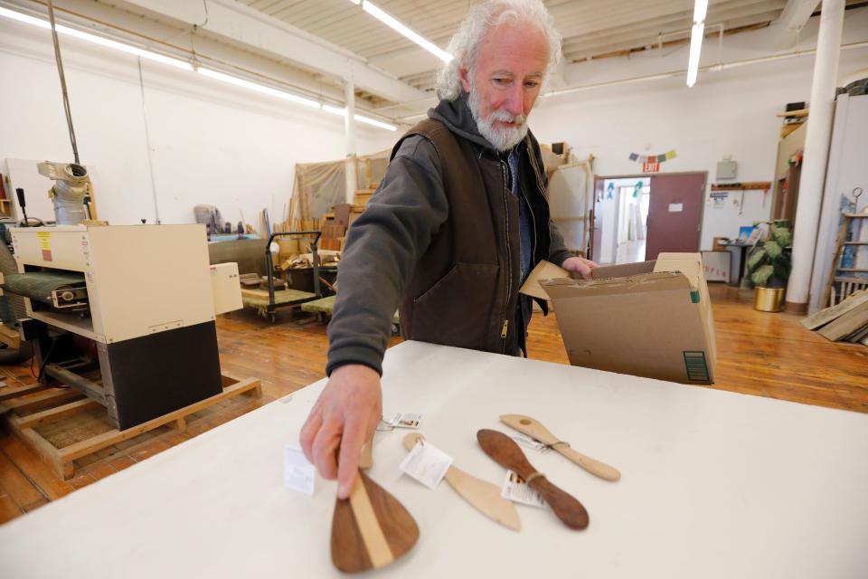 Michael Pietragalla puts out some of his custom-made wooden spoons and chopsticks he made in his studio at the Hatch Street Studios in New Bedford.