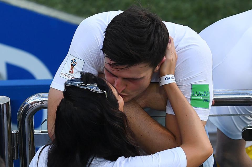 England's defender Harry Maguire kisses his girlfriend Fern Hawkins after the Russia 2018 World Cup (AFP via Getty Images)