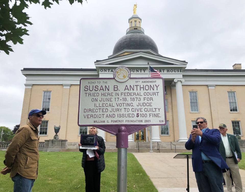 Canandaigua City Supervisor Rich Russell, left, and Mayor Bob Palumbo check out a new historical marker noting suffragist Susan B. Anthony's trial at the Ontario County Courthouse as Ontario County Historian Preston Pierce and SUNY Oneonta professor emeritus Judith Wellman look on.