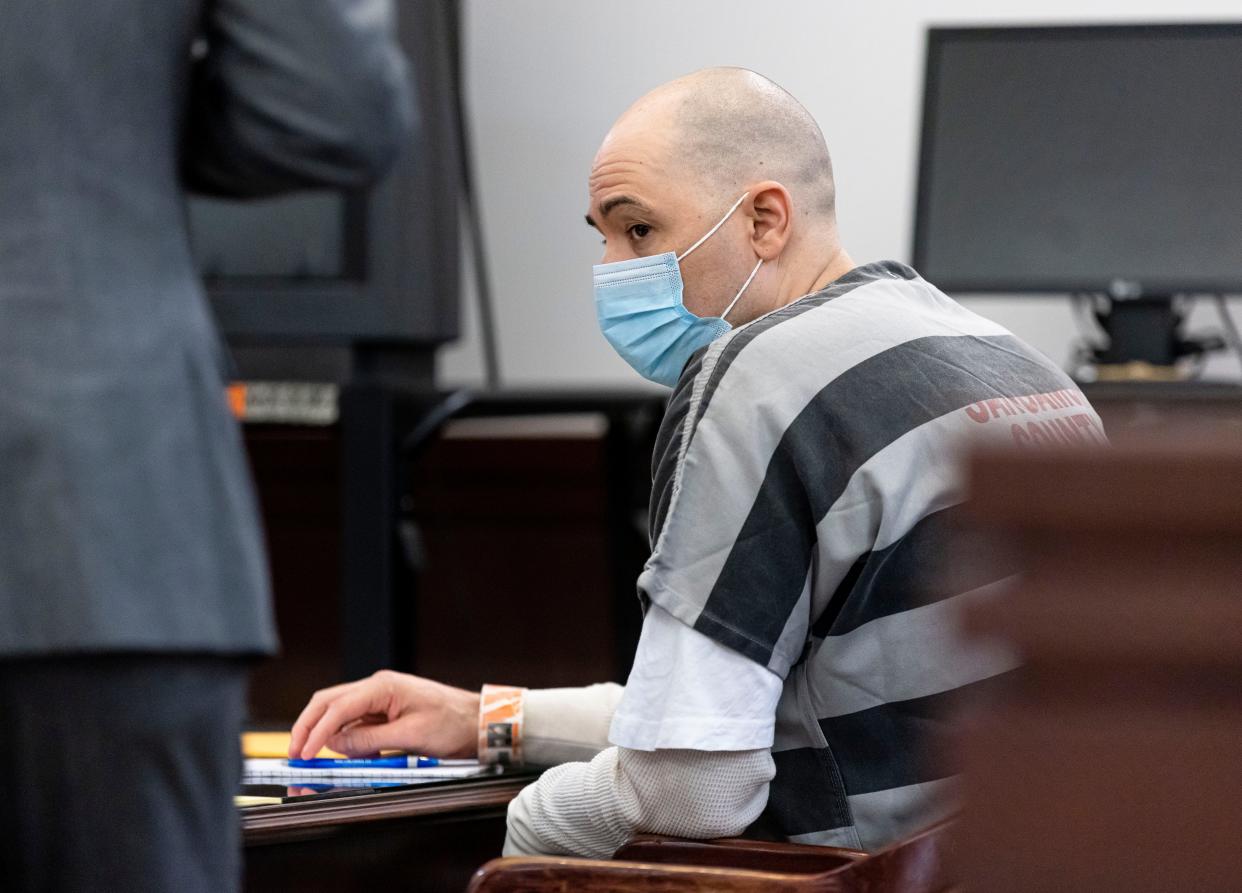 Adam Lopez looks over as his attorney returns from speaking with State's Attorney Dan Wright while appearing in the courtroom of Associate Judge Rudolph Braud at the Sangamon County Complex in Springfield, Ill., Monday, May 3, 2021.