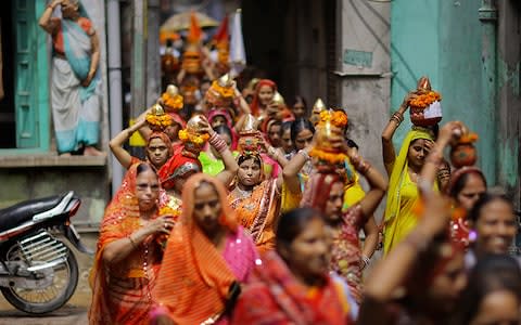 A procession of women on the streets of New Delhi - Credit: TIMOTHY ALLEN