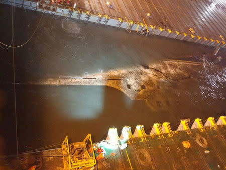 The sunken ferry Sewol is raised during its salvage operations on the sea off Jindo, South Korea, in this handout picture provided by the Ministry of Oceans and Fisheries and released by Yonhap on March 23, 2017. The Ministry of Oceans and Fisheries/Yonhap via REUTERS