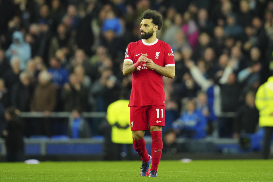 Liverpool's Mohamed Salah leaves field on the full time of the English Premier League soccer match between Everton and Liverpool at the Goodison Park stadium in Liverpool, Britain, Wednesday, April 24, 2024. Everton won 2-0. (AP Photo/Jon Super)