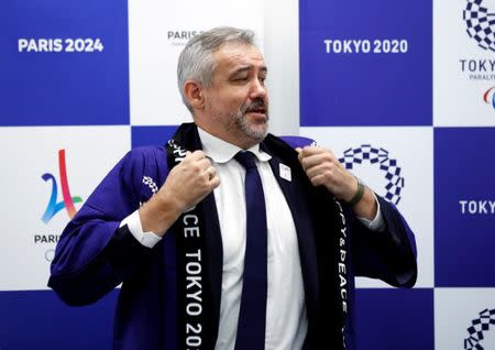 Etienne Thobois, Paris 2024 Director General, wears Japanese happi coat after receiving it as a souvenir during a ceremony marking conclusion of MoU between Tokyo 2020 and Paris 2024 Olympic Games in Tokyo, Japan, July 11, 2018. REUTERS/Kim Kyung-Hoon