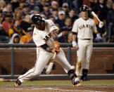 San Francisco Giants' Pablo Sandoval drives in a run with a single against the Los Angeles Dodgers during the seventh inning of a baseball game on Wednesday, April 16, 2014, in San Francisco. (AP Photo/Marcio Jose Sanchez)