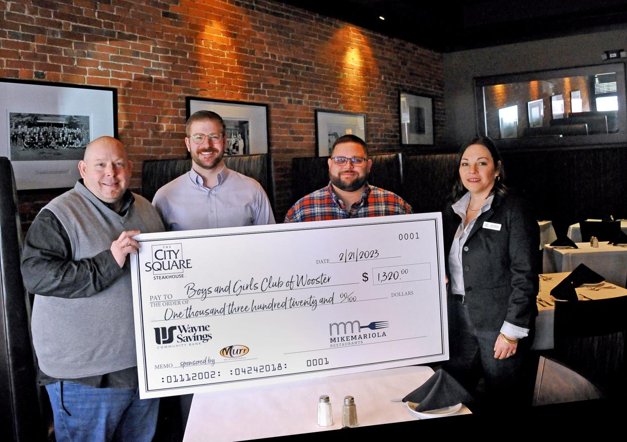 The Boys and Girls Club of Wooster accepts a ceremonial check for $1,320, collected in a fundraiser from City Square Steakhouse on Thursday. The money will be used to support the club's breakfast program in area schools. From left is Jon Hutchison, executive director; Ben Callendar, general manager City Square; Brad Gowins, board member and Jenni Szafranski, director of development.