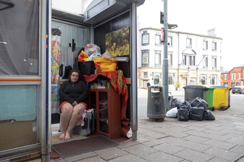 Destiny Mitchell, 26, is homeless and has turned a bus stop into a temporary home on the Bristol Road, Selly Oak. -Credit:Anita Maric / SWNS