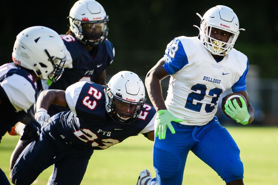 St. Pauls running back Kemarion Baldwin (23) is among the top high school football players in the region to watch in the NCHSAA playoffs.