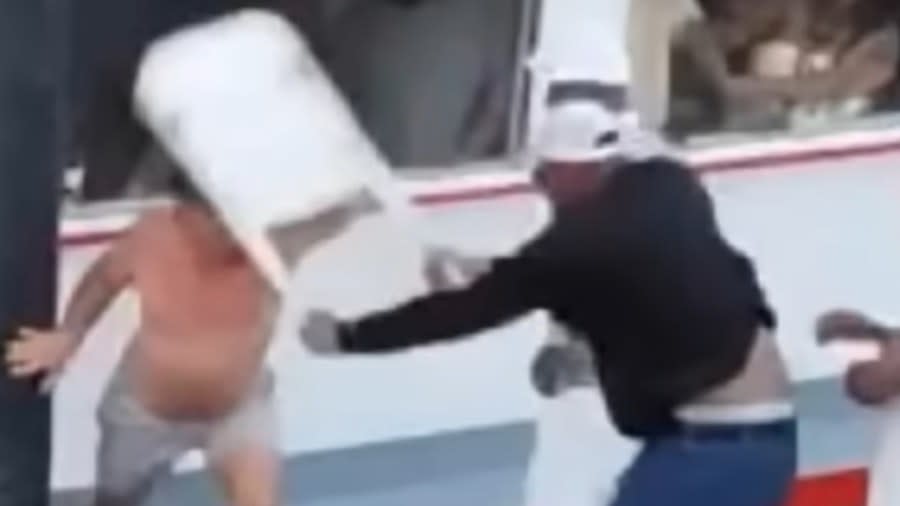 Reggie Ray (right) seen wielding a chair during the viral riverfront brawl in Montgomery, Alabama, posted bail and was released from the Montgomery Municipal Jail on Saturday. (Photo: Screenshot/YouTube.com/Rickey Smiley)