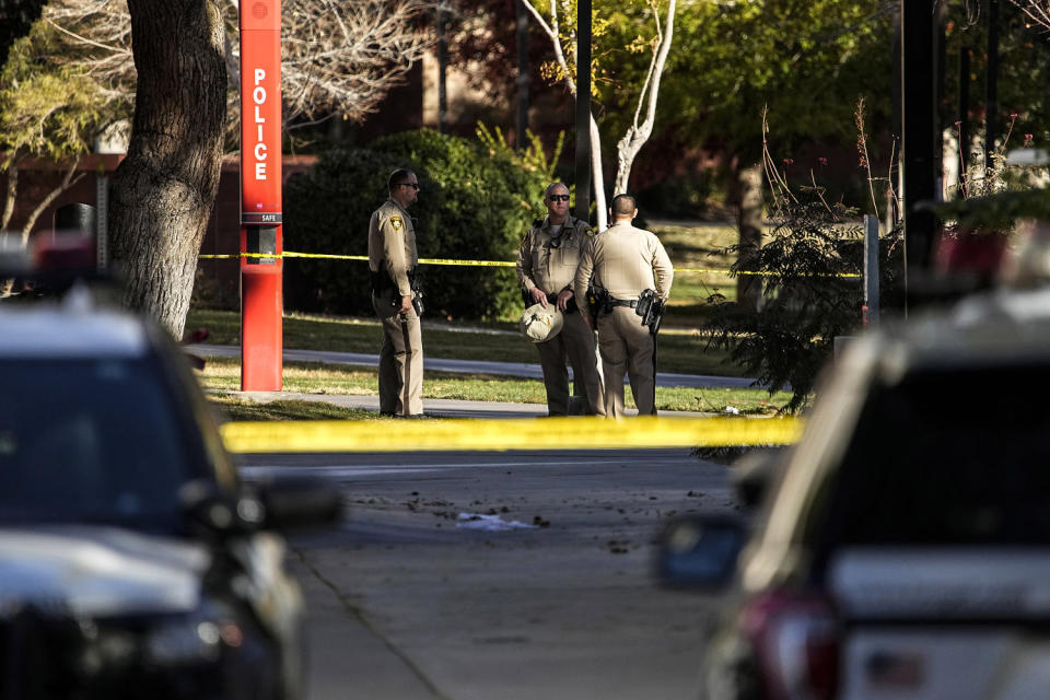 Image: Las Vegas police stand near the scene of a shooting at the University of Nevada, Las Vegas (John Locher / AP)