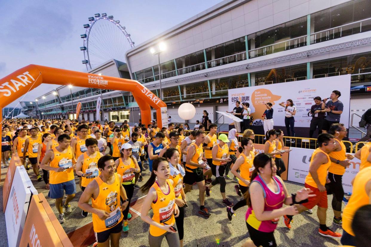 Runners at the start point of the Income Eco Run 2018 at the Formula One Pit Building. The 2019 edition will be held at the same location on 28 April. (PHOTO: Income Eco Run/Facebook)