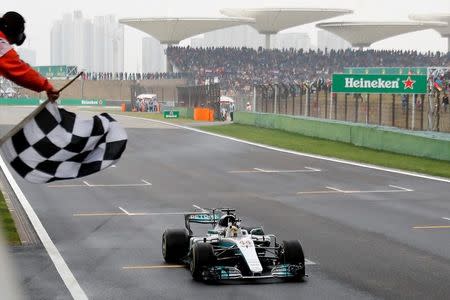 Mercedes driver Lewis Hamilton of Britain gets the checkered flag to win the Chinese Formula One Grand Prix at the Shanghai International Circuit in Shanghai, China, Sunday, April 9, 2017. REUTERS/Andy Wong/Pool -