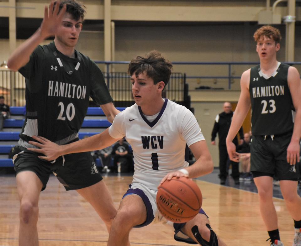 West Canada Valley Indian Brayden Shoardson (1) handles tyhe ball against Hamilton and Emerald Knight Ethan Nagle (20) Sunday, Jan. 8, 2023,  at IAABO Board No. 51's Mohawk Valley Basketball Classic at Hamilton College in Clinton, New York.