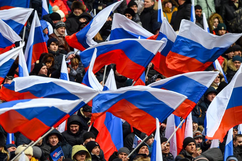 <p>Supporters of presidential candidate, President Vladimir Putin gather for a pre-election rally at the Luzhniki stadium in Moscow on March 3, 2018. (Photo: Kirill Kudryavtsev/AFP/Getty Images) </p>