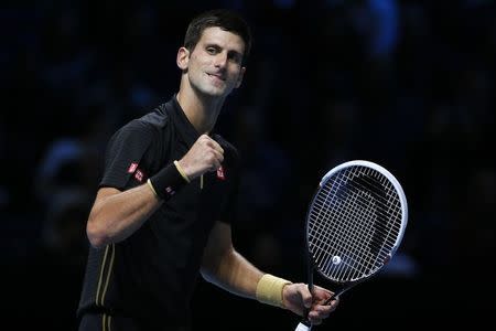 Novak Djokovic of Serbia celebrates after winning his tennis match against Marin Cilic of Croatia at the ATP World Tour finals at the O2 Arena in London November 10, 2014. REUTERS/Stefan Wermuth