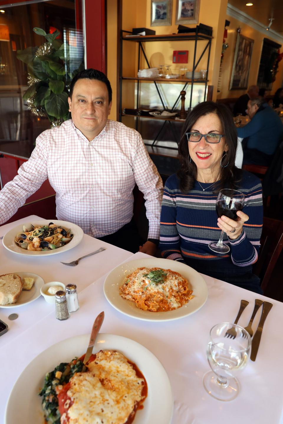 Lohud food reporter Jeanne Muchnick with co-owner Marco Lojano at Rosie's Bistro Italiano in Bronxville Nov. 30, 2023.