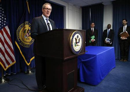 U.S. Trade Representative Michael Froman (L) is flanked by members of the U.S. Trade Representative counsel's office as he announces a trade enforcement action tied to India, in Washington, February 10, 2014. REUTERS/Jonathan Ernst