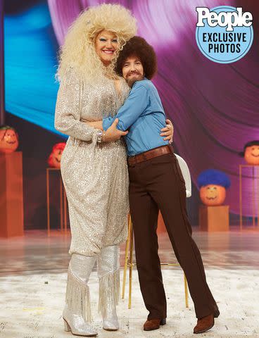 <p>The Drew Barrymore Show/Ash Bean</p> Ross Matthews and Drew Barrymore share a hug while dressed as Dolly Parton and Bob Ross on 'The Drew Barrymore Show'