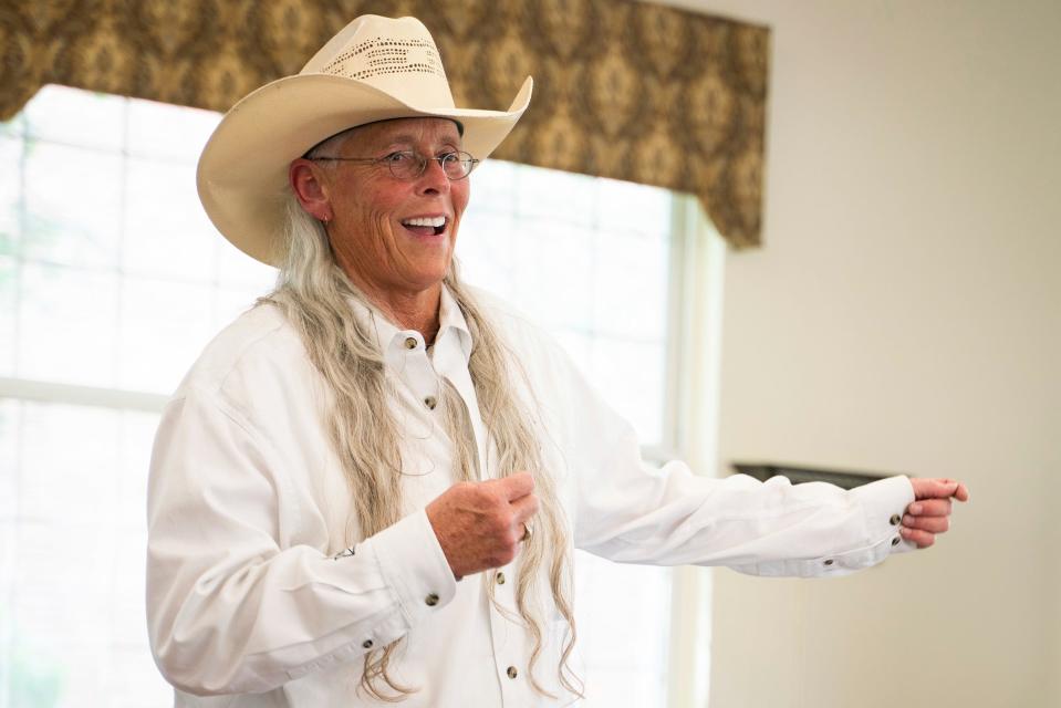 Tucker Jasso, 60, founder of For the Love of Charlie, talks with seniors about her cannabis company, at Baldwin House Senior Living in Hazel Park on Wednesday, Aug. 9, 2023.