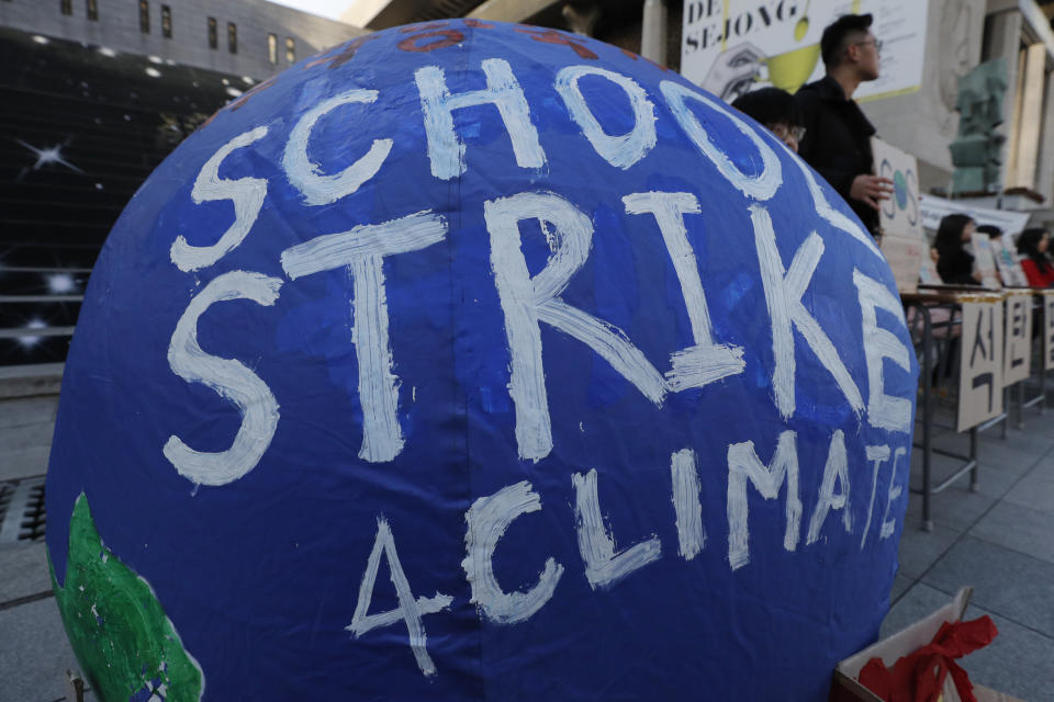 South Korean students hold banners during a rally for climate strike for future in Seoul, South Korea, Friday, Nov. 29, 2019. More than 10 students attended the rally demanding their governments to take sufficient action against climate change. (AP Photo/Lee Jin-man)