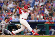 Philadelphia Phillies' Darick Hall follows through after hitting a home run against St. Louis Cardinals pitcher Miles Mikolas during the sixth inning of a baseball game, Friday, July 1, 2022, in Philadelphia. (AP Photo/Matt Slocum)