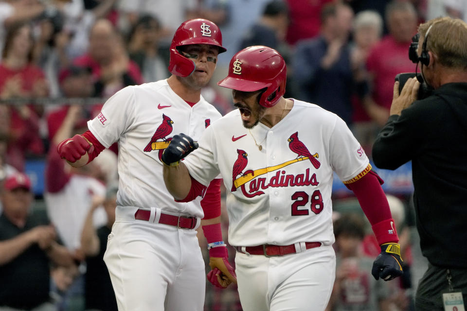 St. Louis Cardinals' Nolan Arenado (28) is congratulated by teammate Lars Nootbaar after hitting a three-run home run during the first inning of a baseball game against the Milwaukee Brewers Monday, May 15, 2023, in St. Louis. (AP Photo/Jeff Roberson)