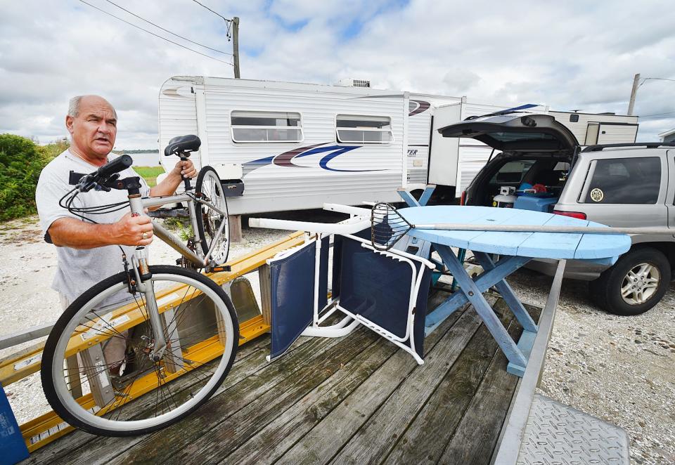Frankie Ray of Westport packs up some items from his lot near Westport Town Beach on Tuesday, Sept. 12.