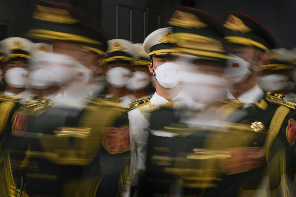 Members of an honor guard march during a welcoming ceremony for Solomon Islands Prime Minister Manasseh Sogavare at the Great Hall of the People in Beijing, Monday, July 10, 2023. (AP Photo/Andy Wong, Pool)
