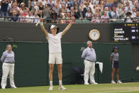 Italy's Jannik Sinner celebrates winning his match against Russia's Roman Safiullin during their men's singles match on day nine of the Wimbledon tennis championships in London, Tuesday, July 11, 2023. (AP Photo/Alberto Pezzali)