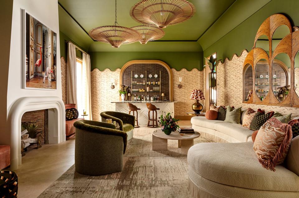 McCann Design Group chose a color scheme of olive, terra cotta, ivory and rose for this lounge at the Kips Bay Decorator Show House Palm Beach.