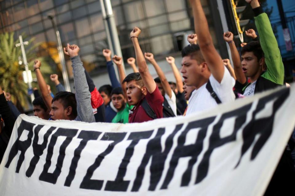 Students participate in a march in Mexico City to mark the 65th month since the disappearance of the 43 missing Ayotzinapa students in the state of Guerrero, 26 February 2020.