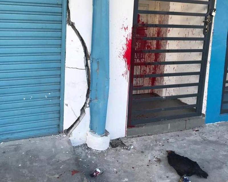 The Johor Baru Parliamentary Service Centre had been splashed with red paint and a chicken carcass with a threatening message thrown in front of the door. ― Picture via Facebook/Akmal Nasir