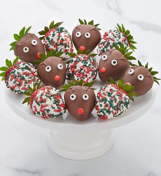 <p><a href="https://go.redirectingat.com?id=74968X1596630&url=https%3A%2F%2Fwww.berries.com%2Fsantas-reindeer-dipped-strawberries-192897&sref=https%3A%2F%2Fwww.thepioneerwoman.com%2Ffood-cooking%2Fg38290860%2Fchristmas-gift-baskets%2F" rel="nofollow noopener" target="_blank" data-ylk="slk:Shop Now;elm:context_link;itc:0;sec:content-canvas" class="link ">Shop Now</a></p><p>Santa’s Reindeer Dipped Strawberries</p><p>$49.99</p><span class="copyright">Shari's Berries</span>