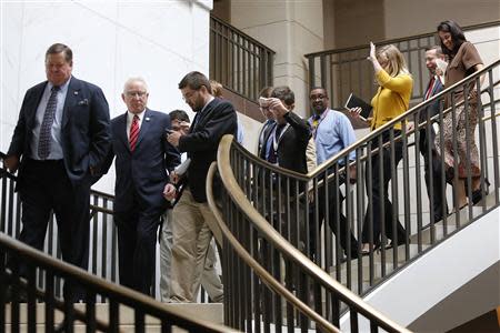 House Armed Services Committee Chairman Buck McKeon (R-CA) (2nd L) is trailed by reporters as he arrives for a closed-door briefing by high-level members of the Obama administration on their proposal to take limited military action in Syria, at the U.S. Capitol in Washington, September 9, 2013. REUTERS/Jonathan Ernst