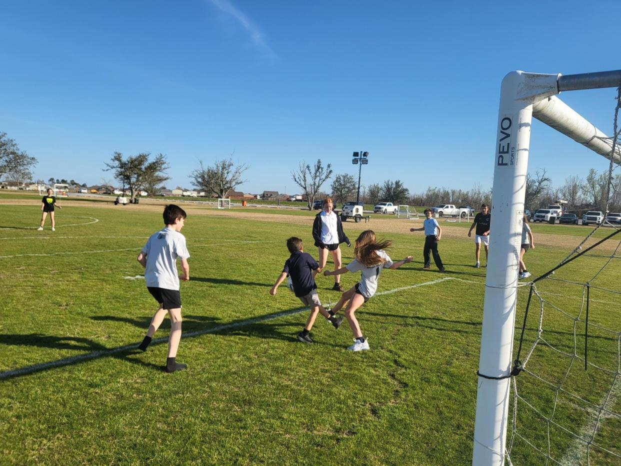 Children play in a neighboring soccer field at the Bayou Country Sports Park in Houma as Terrebonne Parish officials break ground on new two soccer fields Monday, Feb. 6, 2023.