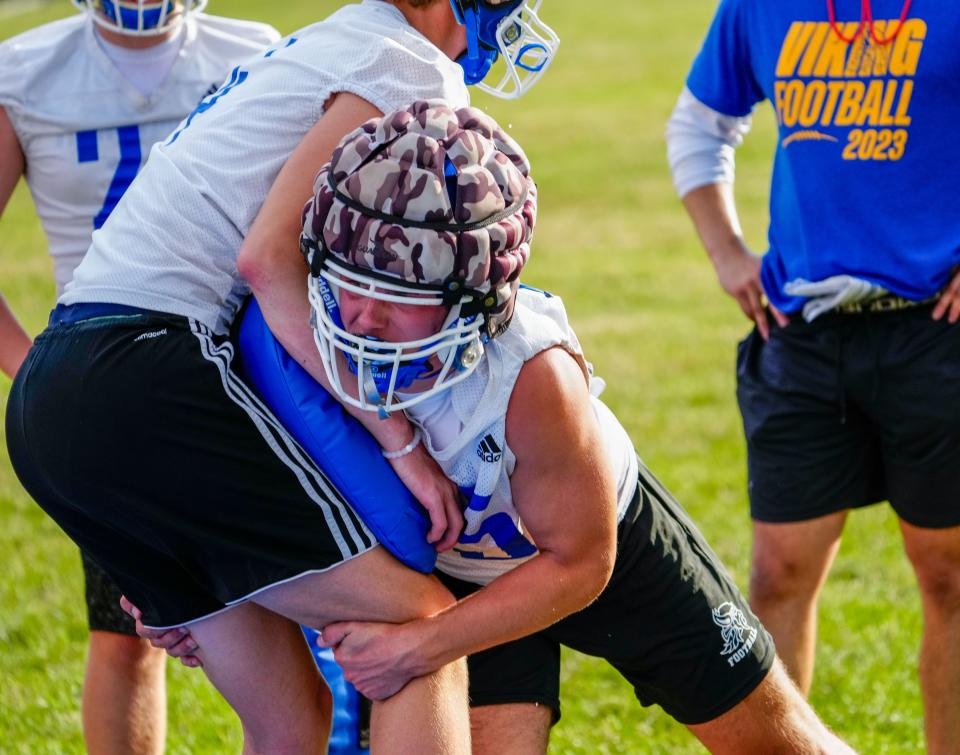 New Berlin West’s Ty Hegarty, right, works on a tackling drill during the first day of high school football practice on Tuesday, August 1, 2023. (Syndication: Journal Sentinel)