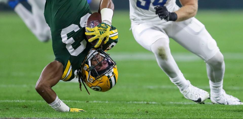 Green Bay Packers running back <a class="link " href="https://sports.yahoo.com/nfl/players/30295" data-i13n="sec:content-canvas;subsec:anchor_text;elm:context_link" data-ylk="slk:Aaron Jones;sec:content-canvas;subsec:anchor_text;elm:context_link;itc:0">Aaron Jones</a> (33) is upended against the Detroit Lions during their football game on Thursday, September 28, 2023, at Lambeau Field in Green Bay, Wis.<br>Tork Mason/USA TODAY NETWORK-Wisconsin