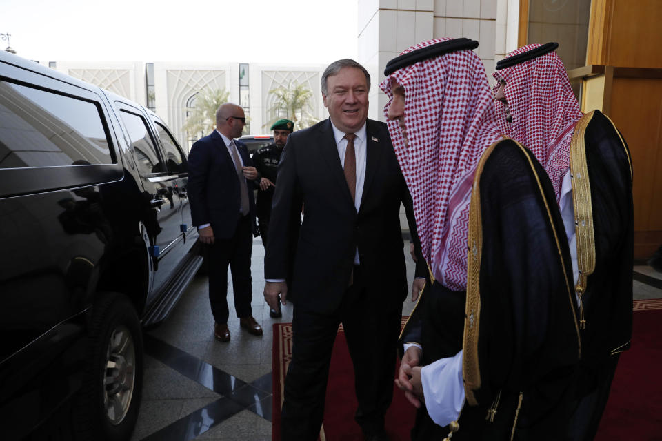 U.S. Secretary of State Mike Pompeo, center, walks with Saudi Foreign Minister Adel al-Jubeir in Riyadh, Saudi Arabia, Tuesday Oct. 16, 2018. U.S. Secretary of State Mike Pompeo met on Tuesday with Saudi Arabia's King Salman over the disappearance and alleged slaying of Saudi writer Jamal Khashoggi, who vanished two weeks ago during a visit to the Saudi Consulate in Istanbul. (Leah Millis/Pool via AP)