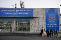 FILE - Taliban personnel and airport staffers sit at the airport in Kabul, Afghanistan, Sept. 9, 2021. A year after America's tumultuous and deadly withdrawal from Afghanistan, assessments of its impact are divided — and largely along partisan lines. (AP Photo/Bernat Armangue, File)