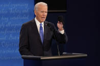 Democratic presidential candidate former Vice President Joe Biden holds up a mask during the second and final presidential debate Thursday, Oct. 22, 2020, at Belmont University in Nashville, Tenn. (AP Photo/Morry Gash, Pool)