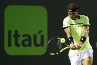 Mar 29, 2017; Miami, FL, USA; Rafael Nadal of Spain hits a backhand against Jack Sock of the United States (not pictured) on day nine of the 2017 Miami Open at Crandon Park Tennis Center. Nadal won 6-2, 6-3. Mandatory Credit: Geoff Burke-USA TODAY Sports