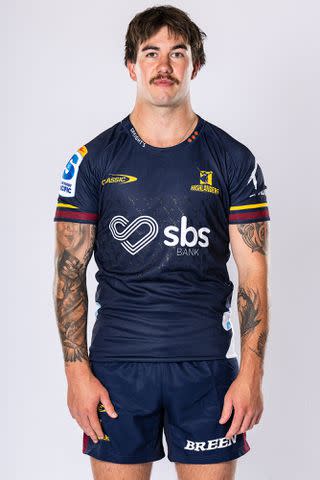 <p>Joe Allison/Getty </p> Connor Garden-Bachop posing during a Highlanders 2024 Super Rugby Headshots Session on November 24, 2023 in Dunedin, New Zealand