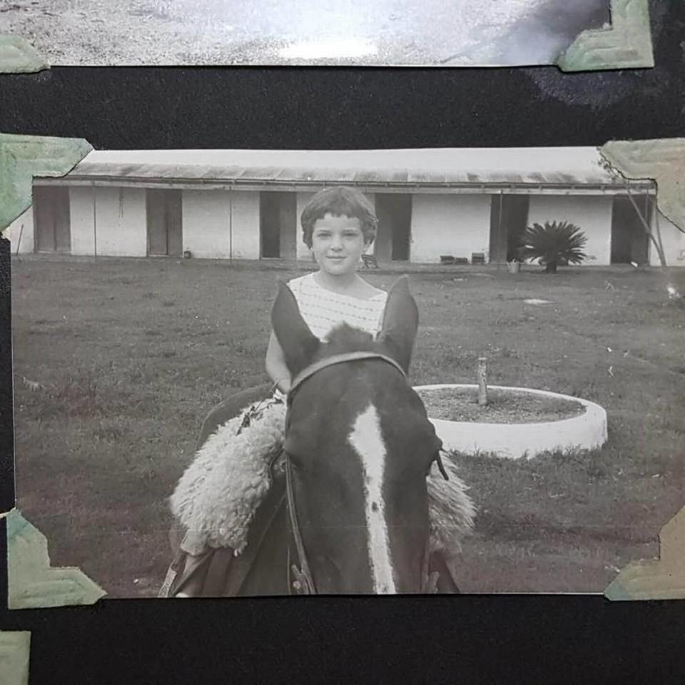 Gabriela Camou, who died in the Champlan Towers South collapse, riding a horse as a child. Her brother said she was a skilled rider.
