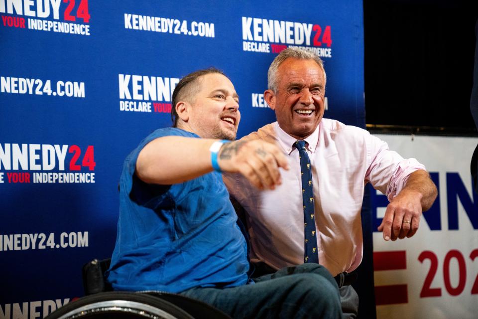 Supporters take photos with independent presidential candidate Robert F. Kennedy Jr. after a campaign event Saturday, April 13, 2024, at the Val Air Ballroom in West Des Moines.