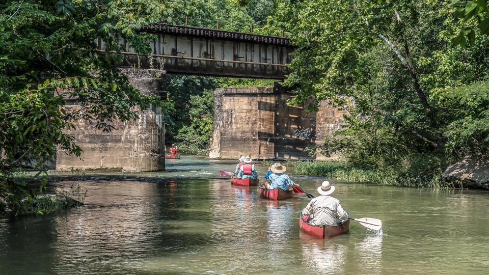 A group canoeing down the Cahaba River in Helena, Alabama in the Summer.