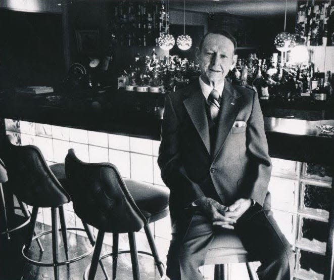 Local gambling kingpin Clarence Wood sitting at his home bar on Nov. 12, 1980. In 1922 he and his father were arrested for bootlegging.