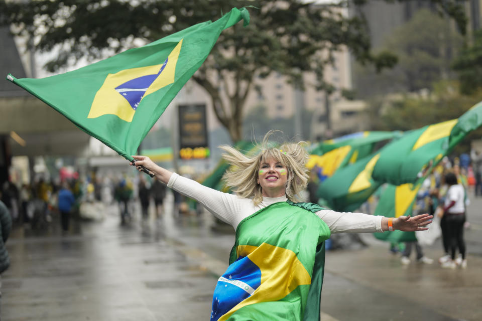 A supporter of Brazilian President Jair Bolsonaro, who is running for a second term, attends a demonstration to celebrate the bicentennial of the country's independence in Sao Paulo, Brazil, Wednesday, Sept. 7, 2022. (AP Photo/Andre Penner)