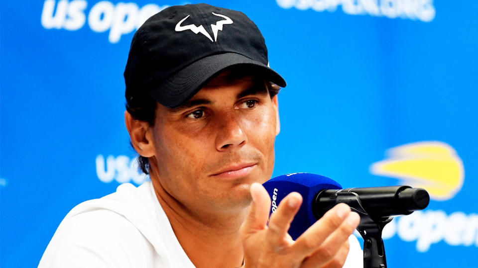 Rafael Nadal shrugs as he answers a question from the media.